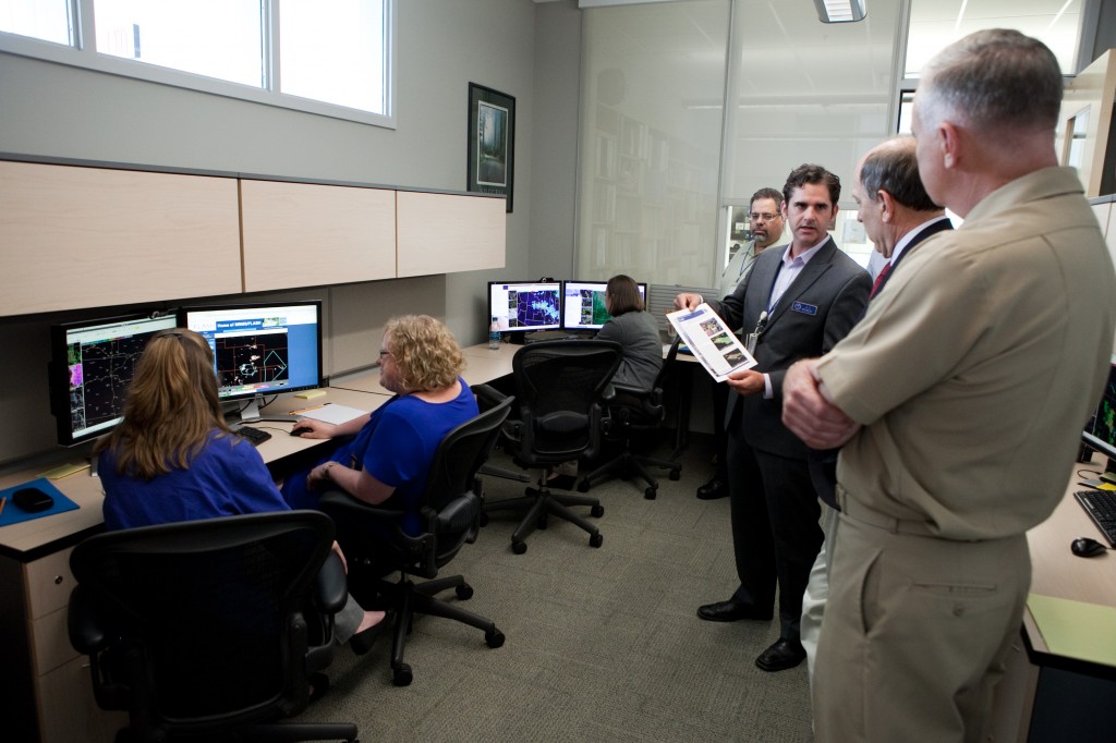 Dr. JJ Gourley explains the HWT-Hydro experiment to NWS Director Dr. Louis Uccellini and NOAA Deputy Under Secretary Vice Adm. Michael Devany